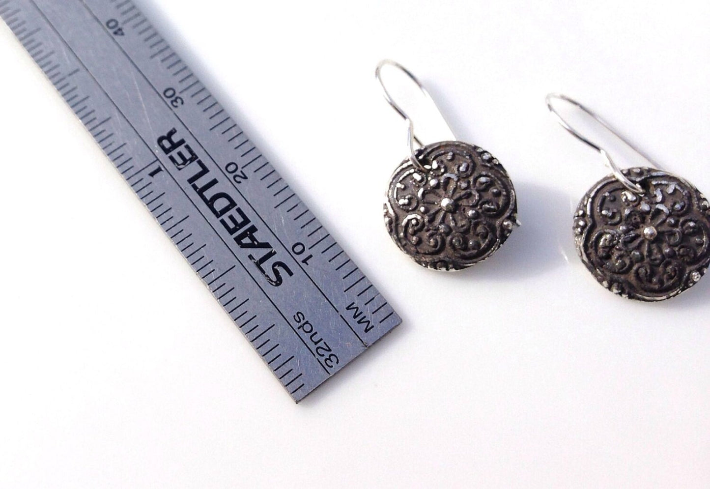 Silver floral medallion earrings
