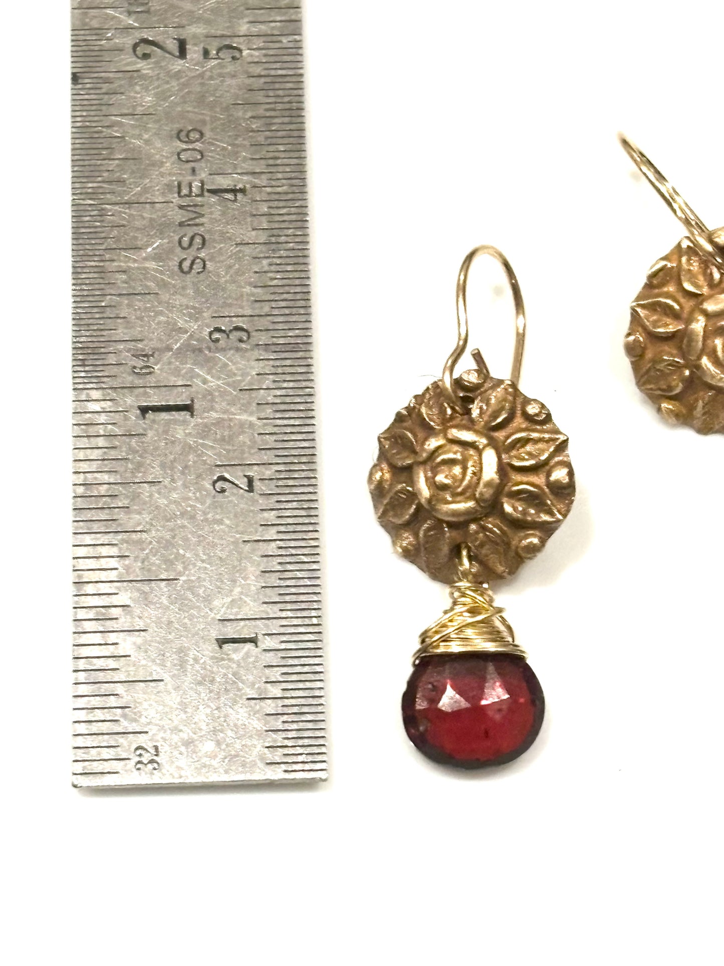 Garnets with bronze button medallion