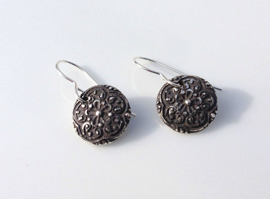 Silver floral medallion earrings