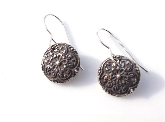 Silver floral medallion earrings